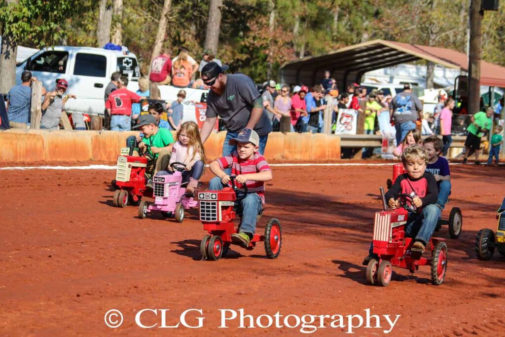 Kiddie Pedal Tractor Race Diesels In Dark Corners